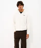 Pantalón baggy masculino de corderoy marrón con textura acanalada, corte holgado, cintura con presillas, cierre frontal y bolsillos funcionales.