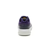 Zapatillas Caterpillar Hex Lite Leather, color azul marino con detalles en violeta y suela blanca.