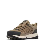 Championes de trekking Columbia modelo Strata Trail Low WP, color marrón con detalles en gris oscuro y suela blanca. Diseño impermeable con tecnología Omni-Tech, entresuela TechLite para amortiguación y suela Omni-Grip para tracción en diversos terrenos.