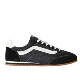 Championes Vans Super Lowpro de perfil bajo, color negro con detalles en blanco. Presentan cierre de cordones, lengüeta acolchada y suela exterior de caucho con diseño Waffle.