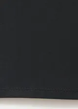Pantalón largo gris oscuro de tiro medio, con cintura elástica y detalles de tachas metálicas redondas en el borde de la cintura, corte recto y silueta amplia.