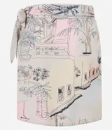 Pollera recta corta de viscosa en color beige con estampado de paisajes y palmeras, con lazo lateral ajustable en la cintura.
