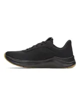 Championes de entrenamiento Under Armour modelo W Aurora 3, diseñados específicamente para el pie femenino. Presentan una parte superior de malla transpirable en color negro con detalles de gamuza, mediasuela con amortiguación Charged+ y suela de goma color caramelo con patrón de tracción multidireccional.