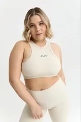 Top deportivo de diseño halter con ajuste ultra contenedor, confeccionado en tejido técnico de poliamida y spandex. Presenta el logo de la marca estampado en el centro del pecho.