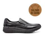 Zapato casual de cuero negro, estilo mocasín, con elásticos laterales y suela de goma.
