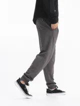 Pantalon de jogging de felpa color gris, con cintura elástica ajustable mediante cordón y puños elásticos en los tobillos.