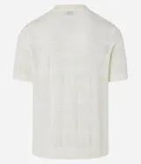 Remera polo de manga corta color crudo, con textura patchwork en cuadrados diferentes.