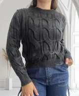 Sweater negro de tejido de punto con diseño de trenzas y roturas.