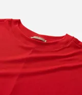 Blusa tipo muscle tee de corte holgado, confeccionada en tejido rib acanalado, con escote redondo y diseño sin mangas.