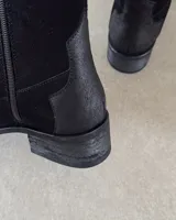 Botas texanas cortas de cuero vacuno color negro, con puntera fina y taco bajo.