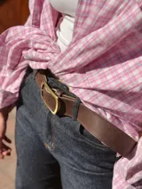 Camisa oversize de manga larga con estampado de cuadros escoceses en tono rosa y blanco, de corte holgado y cuello camisero.