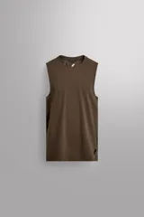 Musculosa deportiva de Zara Athleticz, confeccionada en tejido técnico elástico y transpirable. Presenta cuello redondo, diseño sin mangas y costuras planas termoselladas para mayor confort. Incluye detalle de logo en el dobladillo inferior.