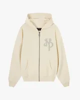 Campera con cierre frontal de Nude Project, confeccionada en algodón de alto gramaje con diseño oversized. Presenta capucha, bolsillos tipo canguro y un parche bordado con las iniciales NP en el pecho.