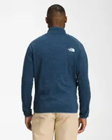 Chaqueta de polar azul con cierre completo, cuello alto y bolsillos laterales con cierre. Logo de The North Face bordado en el pecho.