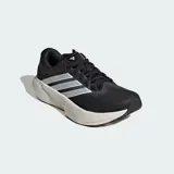 Championes de running Adidas Supernova Rise 3, color negro con las tres tiras laterales en blanco y mediasuela de amortiguación Dreamstrike+ en tono crema. Confeccionados con exterior de tela técnica Primeweave y suela de caucho Lighttraxion.