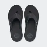 Ojotas Reef Phantom Nias color negro, con plantilla texturizada y logo de la marca en la tira.