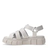 Sandalias de cuero color beige, con diseño de tiras anchas entrelazadas y suela de plataforma dentada. Cuenta con cierre de velcro en el talón para un ajuste seguro.