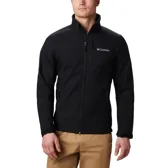 Chaqueta softshell Columbia para hombre, color negro, con cierre frontal, cuello alto y logo de la marca en blanco en el pecho. Presenta bolsillos laterales y uno en el pecho con cierre.