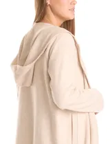 Cardigan largo tipo duster de la marca Dictionary, color beige, con capucha, frente abierto, manga larga y bolsillos laterales.