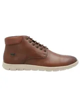 Botín de cuero color marrón con ajuste de cordones, cuello acolchado y suela de goma en color beige. Presenta el logo de la marca RKF grabado en el lateral.