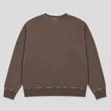 Buzo de cuello redondo con efecto lavado, de corte oversize y mangas largas con puños acanalados.