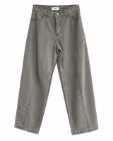 Jean baggy gris de tiro medio con costuras y cortes decorativos en las piernas, de diseño holgado y estilo urbano.