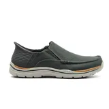 Zapato Skechers Slip-Ins Relaxed Fit: Expected - Cayson, color gris oscuro, sin cordones, con capellada de lona, puntera tipo mocasín, paneles laterales elásticos, plantilla Air-Cooled Memory Foam y tecnología Heel Pillow.