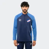Buzo de entrenamiento Umbro del Club Nacional de Football, con medio cierre frontal, mangas largas y diseño en bloques de color azul y azul marino. Cuenta con el logo de la marca y el escudo del club en el pecho.
