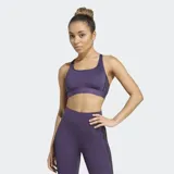 Top deportivo Adidas modelo Powerreact en color violeta, diseñado para entrenamientos de impacto medio. Confeccionado con tecnología CLIMACOOL para mayor transpirabilidad, presenta un cuello cuadrado, espalda deportiva y paneles de malla. Incluye almohadillas removibles y las clásicas tres tiras laterales en contraste.