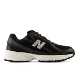 Championes urbanos New Balance modelo 740, color negro con entresuela blanca. Presentan una parte superior de malla transpirable con superposiciones sintéticas y el logo 'N' lateral con estampado de animal print.