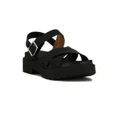 Sandalias negras de plataforma con suela track, tiras cruzadas en la parte delantera y tira ajustable con hebilla metálica en el tobillo.