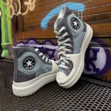 Championes de caña alta Converse Chuck Taylor Construct, con plataforma, en colores gris, celeste y blanco.
