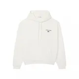 Canguro Lacoste de color blanco, con capucha ajustable mediante cordones, bolsillo frontal tipo canguro y puños y ruedo acanalados. Presenta un pequeño bordado en el pecho con el logo de la marca y la frase 'Jeu Set et Match'.