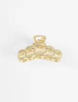 Broche para el pelo color dorado con forma de cadena gruesa.