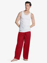 Pantalón de pijama rojo con estampado de logos de Tommy Hilfiger en blanco.