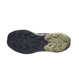 Championes de trail running Salomon modelo Elixir Activ, con diseño técnico en combinación de colores azul marino y beige. Presentan suela con tecnología Contagrip para mayor tracción y chasis activo para estabilidad.