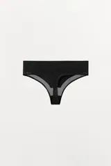 Tanga de tiro alto con cintura ancha, confeccionado en tejido de poliamida con detalles de transparencia en los bordes.