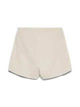 Pollera short de tiro alto y fit holgado, con diseño envolvente en la parte delantera y cierre lateral invisible.