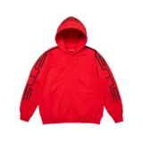 Campera canguro Supreme de color rojo con cierre frontal completo, capucha y bolsillos tipo canguro. Presenta detalles de líneas negras en relieve que recorren las mangas y la capucha.