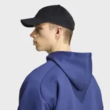 Gorra Adidas Vintage de corduroy color negro, con visera curva y logo bordado en el frente.