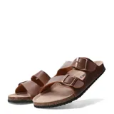 Sandalias de dos bandas negras con hebillas ajustables, base de corcho y suela de goma antideslizante.