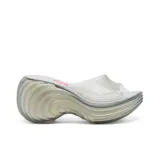 Sandalias Melissa modelo Platform + Diesel, de plataforma alta con diseño ondulado, color azul transparente y logo de Diesel en rojo.