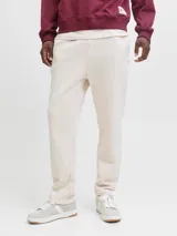 Pantalon de buzo color beige, corte recto, confeccionado en tejido de algodón con cintura elastizada.