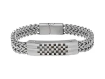 Pulsera de acero plateado con eslabones gruesos y placa central con diseño calado a cuadros.