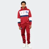 Canguro con capucha de la marca Umbro, oficial del Club Nacional de Football. Presenta un diseño tricolor con bloques en rojo, blanco y azul, bolsillo frontal tipo canguro y cordones ajustables en la capucha.