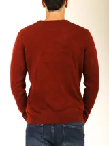 Sweater de tejido de punto color naranja melange, con cuello redondo y manga larga.