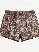 Bóxer de algodón con estampado abstracto en tonos marrones, beige y negro. Presenta cintura elástica con etiqueta central.