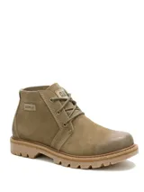 Bota Caterpillar modelo Grader Chukka de color beige, confeccionada en gamuza, con diseño de caña baja, cordones frontales y suela de goma tractorada.