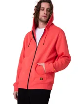 Campera con capucha Caterpillar de color coral, con cierre frontal de cremallera metálica, bolsillos tipo canguro, capucha forrada y puños y bajo de punto acanalado. Cuenta con una pequeña etiqueta con el logo de la marca en el bajo.