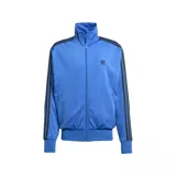 Campera deportiva Adidas Firebird TT color azul con cierre frontal, cuello alto, logo bordado en el pecho y tres rayas negras en las mangas.